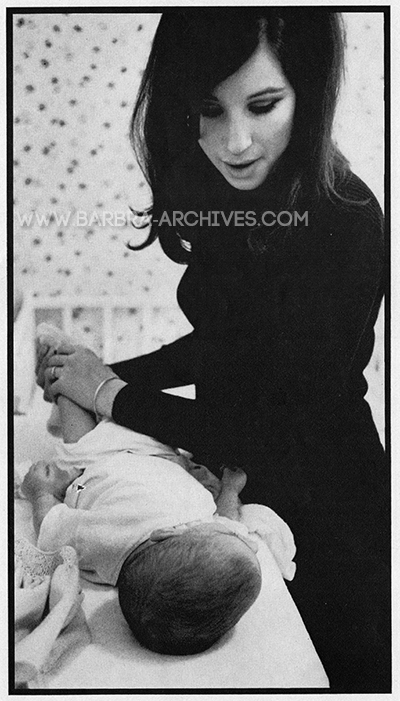 Streisand changing Jason's diaper.