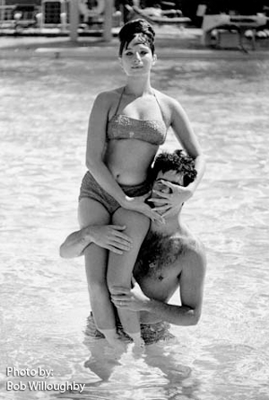 Photo by Bob Willoughby Streisand and Gould at pool