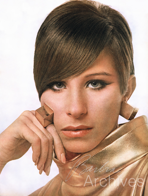 Streisand in gold cube earrings