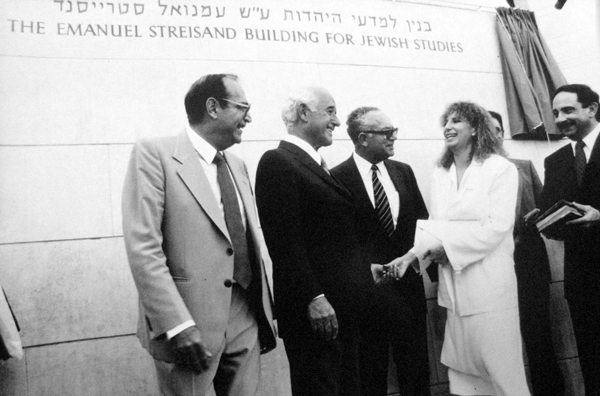 Streisand in front of building dedicated to her father