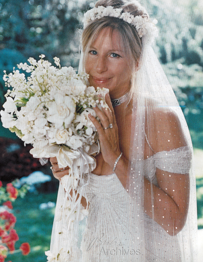 Barbra Streisand in wedding gown with bouquet